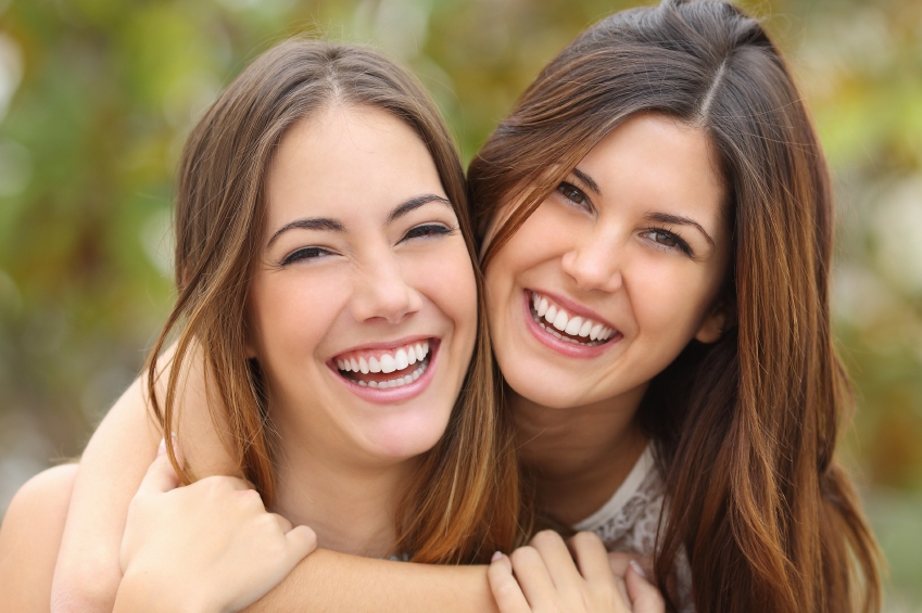 two female friends smiling